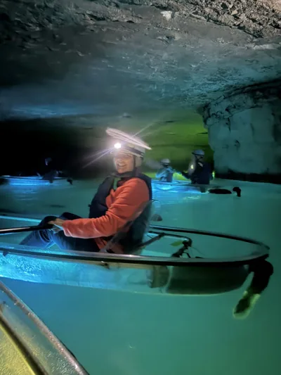 Kayaking in a lit cave